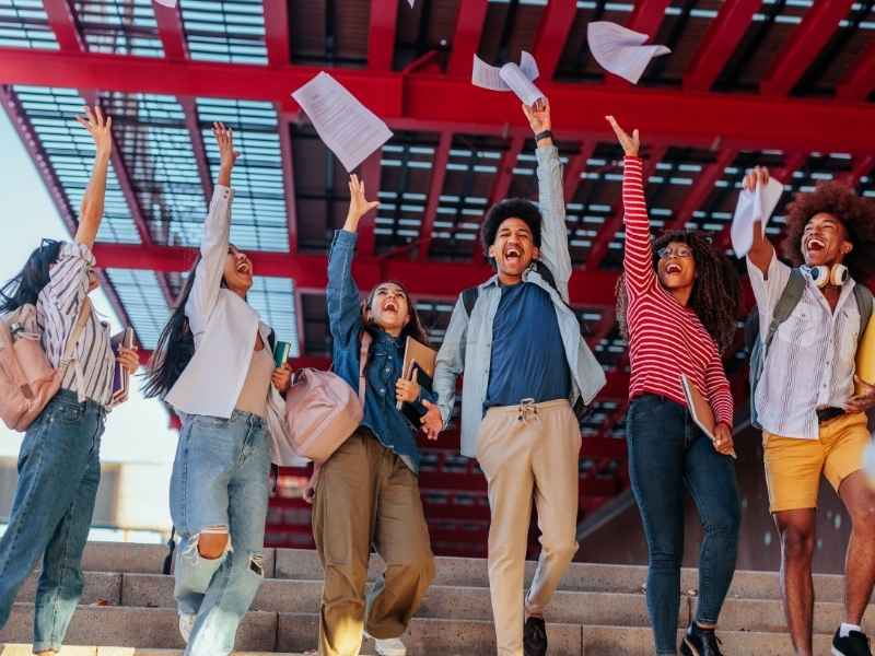Students celebrating academic success representing education as a bridge to future jobs